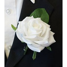 a man in a tuxedo with a white rose on it's lapel