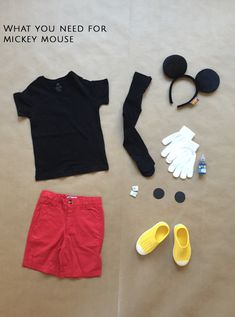 an assortment of clothing and accessories laid out on top of a sheet with the words, what you need for mickey mouse