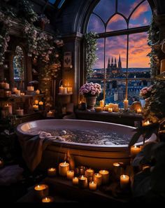 a bathtub filled with lots of candles in front of a large window at night