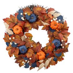 a wreath with pumpkins, leaves and berries