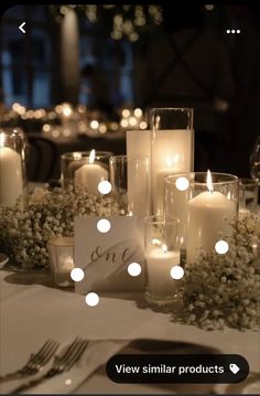 a table with candles and flowers on it