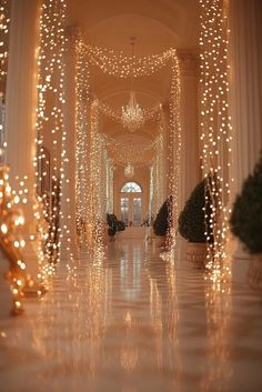 the hallway is decorated with christmas lights and chandeliers