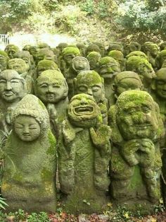 a group of statues made out of moss