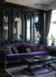 a living room with purple couches and mirrors on the wall above it's windows