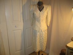 "This stunning skirt suit by Bari Protas for Cachet would be perfect for a more casual bride. 50% cotton, 30% acetate, 20% nylon. Dry clean. The fitted jacket has a button closure with large faux pearl buttons. The bodice has appliques with faux pearls in different sizes. The 3/4 sleeves have large faux pearl detail at the cuffs. Large shoulder pads. The straight skirt has a back zip with hook. Back vent. Scalloped hem on the jacket and skirt. Marked size 9/10 todays 4. The measurements for the Elegant White Skirt Suit For Wedding, Classic White Skirt Suit For Wedding, Elegant Fitted Cream Skirt Suit, Fitted Long Sleeve Skirt Suit For Wedding, Elegant Fitted Skirt Suit For Wedding, Elegant Cream Skirt Suit For Formal Occasions, Elegant Spring Wedding Skirt Suit, Casual Bride, Womens Suits