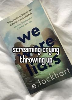 the book we were screaming crying throwing up by e lock hart is laying on a bed