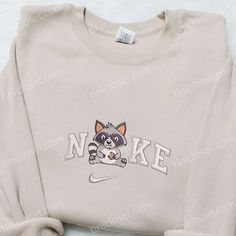 Cute Racoon Eating Cookie x Nike Embroidered Shirt, Animal Embroidered Hoodie, Nike Inspired Embroidered Sweatshirt Casual Hoodie With Machine Embroidery For Streetwear, Casual Embroidered Hoodie For Streetwear, Casual Hooded Sweatshirt With Machine Embroidery, Casual Long Sleeve Hoodie With Machine Embroidery, Casual Long Sleeve Embroidered Hoodie, College Embroidered Hoodie Tops, Casual Embroidered Hoodie For College, Casual Long Sleeve Sweatshirt With Machine Embroidery, Eating Cookie