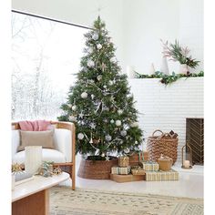 a living room with a christmas tree in the corner