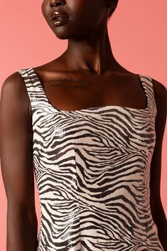 L'MOMO women's mini dress. Embrace your bold side with this adventurous fashion statement. The zebra print offers a unique aesthetic, and when combined with the shine of sequins, it delivers a look that is both stunning and daring. This mini dress is perfect for a night out, a party, or any event where you want to showcase your fearless style. Breathable Stretch Lining Zip Fastening 100% Polyester Care:  Dry Clean Only. Do not bleach Do not tumble dry. Low iron Sleeveless Zebra Print Dress For Night Out, Fitted Zebra Print Mini Dress For Party, Zebra Print Mini Dress For Night Out, Summer Zebra Print Mini Dress For Party, Summer Party Mini Dress With Zebra Print, Chic Tiger Print Mini Dress For Party, Spring Party Mini Dress With Tiger Print, Fitted Zebra Print Mini Dress For Night Out, Zebra Print Mini Party Dress