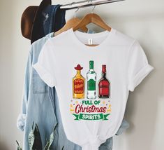 a t - shirt that says full of christmas spirits on it