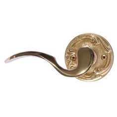 an antique brass door handle on a white background