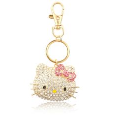 a hello kitty keychain with pink bows on it's head and eyes