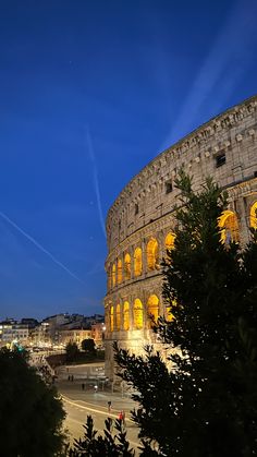 the roman colossion is lit up at night