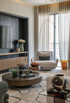 a living room filled with furniture and a flat screen tv