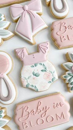 baby in bloom decorated cookies on a table