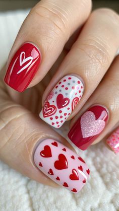 Get ready to make a statement this Valentine’s Day with nail designs that sparkle with love! From dazzling glitter accents to delicate heart motifs, these nail ideas are perfect for celebrating the season of romance. Whether you prefer bold reds, soft pinks, or neutral tones with a touch of glam, there’s something for every style. Let your nails be the ultimate accessory to your Valentine’s outfit and showcase your love for the little details. Perfect for date nights, Galentine’s parties, or simply treating yourself! #valentines #valentinesdaynails Valentines Day Nails Sweet Hearts, Valentine’s Day Nail Ideas For Short Nails, Cute Valentine’s Day Nails Almond Short, Valentines Day Nails Round, Valentine Nail Art Designs Heart, Kiss Nails Designs, Valentine Nail Art Designs Unique, Bling Valentines Nails