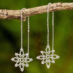 NOVICA Silver Snowflakes Silver Dangle Earrings | The Hunger Site Silver Chandelier Earrings, Falling Snow, Silver Chandelier, Snowflake Earrings, Silver Snowflakes, Printed Jewelry, Silver Gemstone Jewelry, Silver Dangle Earrings, Sterling Silver Dangle Earrings