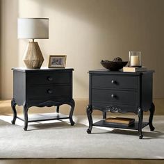 two black nightstands sitting next to each other on top of a white carpeted floor