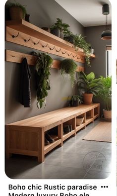 a wooden bench sitting next to a wall filled with potted plants and greenery