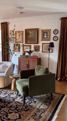 a living room filled with furniture and pictures on the wall