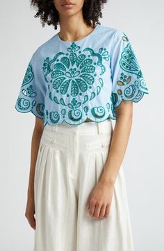 Embroidered eyelets brightly punctuate a lively cropped top designed with wide sleeves and embroidered scalloped edges. 17 1/2" length (size Medium) Back keyhole with button-and-loop closure Jewel neck Short sleeves Partially lined 100% cotton Hand wash, dry flat Imported FARM Rio will plant one tree for every purchase of its product as a partner of the global reforestation nonprofit One Tree Planted Hispanic & Latinx Owned/Founded Light Blue Top, Cotton Crop Top, Scalloped Edges, Farm Rio, Embroidery Dress, Wide Sleeves, Cropped Top, Floral Tops, Casual Wear