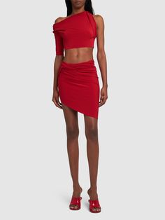 Asymmetrical construction. Model is wearing a sizeS Evening Cropped Elastane Crop Top, Asymmetrical Fitted Crop Top For Evening, Fitted Ruched Crop Top For Evening, Expensive Stuff, Jersey Crop Top, Versace Brand, Jersey Skirt, Flat Espadrilles, Swim Accessories