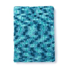 a blue and green knitted blanket on a white background with space for the text