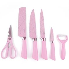 five pink kitchen utensils are lined up next to each other