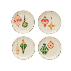 four plates with christmas ornaments hanging from them