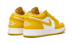 The Air Jordan 1 Low GS “White/Pollen” is the kids sizing of Michael Jordan’s first signature shoe in a two-tone, yellow-and-white colorway reminiscent of popular Nike Dunk styles.  Both designed by Peter Moore in 1985, the Jordan 1 and Dunk share a similar appearance, even more so when Michael Jordan’s first signature shoe is designed in a colorway that mimics the styling of an original colorway of the Dunk.  White leather appears on the perforated toe and mid-panel.  Contrasting yellow or Poll Kids Jordan, Nike Air Jordan 1 Low, Wings Logo, Cute Nike Shoes, Cute Nikes, Yellow Shoes, Stadium Goods, Kids Jordans, Air Jordan 1 Low