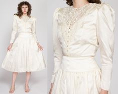 "Vintage 1980s skirt suit by Jessica McClintock in ivory satin with a faint rose and ribbon jacquard print. It features a tailored Victorian style blouse with a lace yoke and pearl buttons up the front, and a high waisted midi-length full skirt. It has shoulder pads that could be easily removed with a seam ripper if desired. Measurements and Condition: Fits like: Labeled size 6, small Fabric: Acetate satin shell, with an acetate crinoline lining in the skirt - labeled dry clean only Brand: Jessica McClintock, made in USA Condition: Skirt is in excellent condition. Blouse is very good, with a tiny brown spot on the 6th from bottom button loop, 4 teeny tiny snags at the bottom of the button placket at the hem, and a tiny faint yellow spot on the front left hem. All flaws are barely noticeabl Satin Skirt Suit, High Waisted Midi Skirt, Suit Vintage, Skirt Two Piece, Bridal Outfit, Button Up Jacket, Skirts Midi High Waisted, Seam Ripper, Jessica Mcclintock