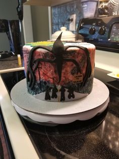 a decorated cake sitting on top of a counter