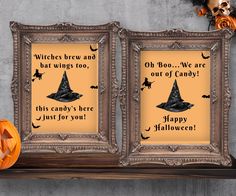 two framed halloween pictures with witches and bats