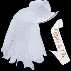 a white hat and veil with the word gone to go written on it next to an arrow