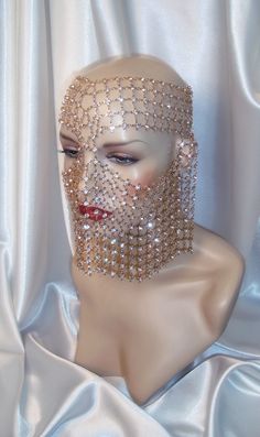 "This face chain mask is brilliant with light and elegance. Constructed entirely of gold chain and rhinestones, it lays comfortably on the face, and the chain links allow for graceful movement in its lower front section. It attaches securely in the back with two sections of chain and lobster claw latches for size adjustment. Mask measures 14\" x 8\" and is one size fits most All items are made in a smoke and pet free environment *ALL SALES ARE FINAL. I DO NOT ACCEPT RETURNS, EXCHANGES, OR CANCEL Bedazzled Gold Jewelry For Party, Gold Bedazzled Jewelry For Party, Gold Carnival Jewelry For Party, Gold Jewelry For Carnival Party, Party Gold Bedazzled Jewelry, Carnival Party Gold Jewelry, Elegant Gold Jewelry For Masquerade, Elegant Mardi Gras Party Jewelry, Gold Masquerade Mask