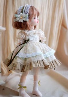 a doll is wearing a dress and shoes