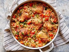 chicken and rice casserole in a pan on a towel