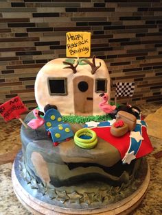 a birthday cake is decorated with an rv