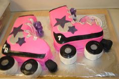 two cakes made to look like cars with wheels and stars on them, sitting on top of plastic wrap