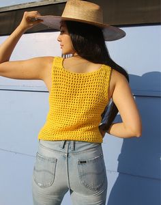 Vintage crochet tank top in yellow. Sleeveless. Scoop neckline. Size S, UK 6-10 / EU 34-38. Measurements- 34"(86cm) bust - 20"(51cm) top length. Material- Wool Condition - Excellent. Care - Handwash Cold Handpicked, repaired and ready to wear. This is an original vintage item, not new and minor signs of wear & age are expected, we will highlight any major flaws.Model is a UK 6/8 and is 5'7" tall Stretch Sleeveless Crochet Top For Summer, Sleeveless Stretch Crochet Top For Summer, Fitted Casual Crochet Vest Top, Casual Fitted Crochet Vest Top, Fitted Yellow Crochet Top For Spring, Yellow Camisole Crop Top For Summer, Fitted Yellow Crochet Top For Summer, Yellow Stretch Camisole Tank Top, Fitted Yellow Camisole For The Beach