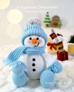 a crocheted snowman sitting on top of a bed