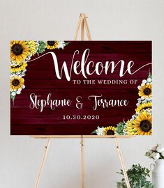 a welcome sign with sunflowers on it