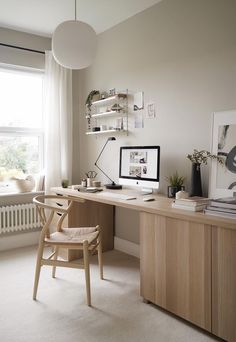 an ikea desk and chair in front of a window