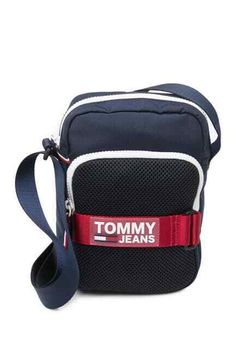 Tommy Hilfiger Womens Blue Cordura Crossbody Bag Details - Adjustable shoulder strap - Wrap around zip closure - Exterior features logo accent, front zip patch pocket, side stripe trim - Interior features laptop sleeve, zip pocket, and slip pocket - Approx. 11" H x 7.5" W x 3" D - Approx. 6.5-12.5" strap drop - Imported Materials Polyester exterior, nylon lining Care Spot clean Shipping: 1. All orders ship on the next business day after receiving your payment. 2. Tracking information will be sen Navy Sporty Bag With Zipper Closure, Sporty Navy Bag With Zipper Closure, Blue Travel Bag With Logo Patch, Casual Blue Bag With Logo Patch, Casual Shoulder Bag With Logo Patch For Travel, Functional Navy Shoulder Bag With Zipper, Casual Blue Bags With Logo Patch, Functional Navy Shoulder Bag With Zipper Closure, Side Stripe