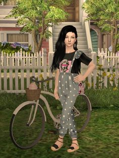 a woman standing next to a bicycle in the grass