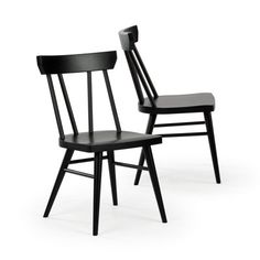 two black chairs sitting next to each other on a white surface with one chair facing the other