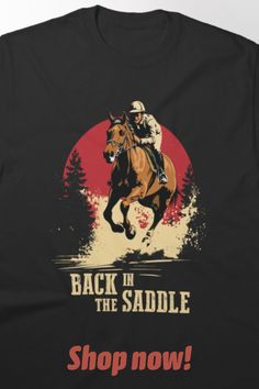 the back in the saddle t - shirt is shown with an image of a horse and rider