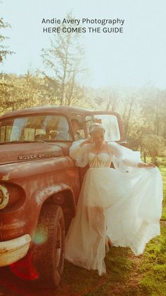 a woman in a wedding dress standing next to an old truck with the words, andie avery photography here comes the guide