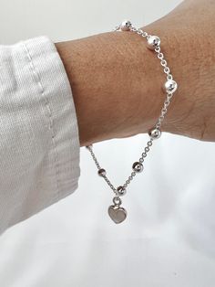 Material: Sterling Silver 925 and mother of pearls heart. Size: 7 inches long with 1 inch extender. Care Instructions- Store in a box or bag in a cool dry place, out of direct sunlight. Elegant Sterling Silver Heart Beads Bracelet, Elegant Heart-shaped Bracelet For Mom, Sterling Silver Heart Beads Bracelet For Gift, Silver Heart Bracelet As Gift For Mom, Sterling Silver Heart Charm Bracelet As Gift For Her, Silver Heart Bracelet Gift For Mom, Handmade Silver Heart Bracelet For Mother's Day, Natural Stones Necklace, Natural Stone Bracelets