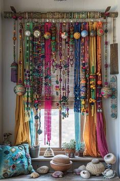 a window covered in lots of different colored beads